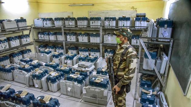 A security personnel guards a strong room where EVMs are kept, after the first phase of Bihar assembly elections, in Patna on Thursday. (PTI) A security personnel guards a strong room where EVMs are kept, after the first phase of Bihar assembly elections, in Patna on Thursday. (PTI)
