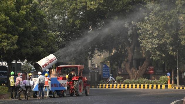 An antismog gun deployed at a construction site sprays water on trees in an attempt to curb air-pollution at Madhav Rao Scindia Marg in New Delhi on October 26. Delhi recorded an air quality index (AQI) of 402 at 2 pm on October 29. Between 0 and 50 is considered good, 51 and 100 satisfactory, 101 and 200 moderate, 201 and 300 poor, 301 and 400 very poor and 401 and 500 to be severe, PTI reported. (Vipin Kumar / HT Photo)