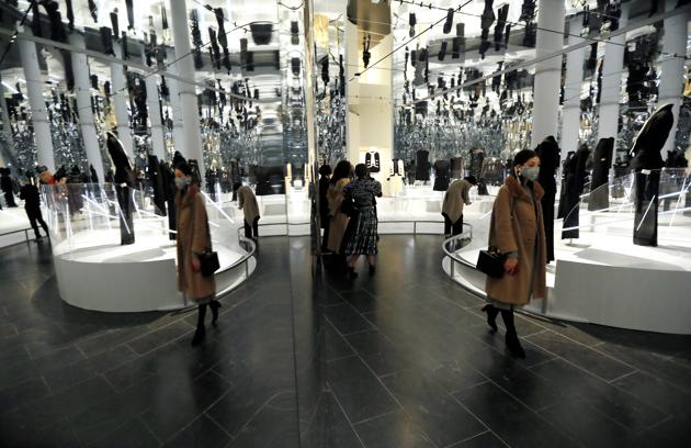 Visitors are reflected in mirrors amid creations displayed at The Costume Institute's upcoming exhibition "About Time: Fashion and Duration" during a press preview at the Metropolitan Museum of Art in Manhattan in New York City, New York, U.S., October 26, 2020. (REUTERS)