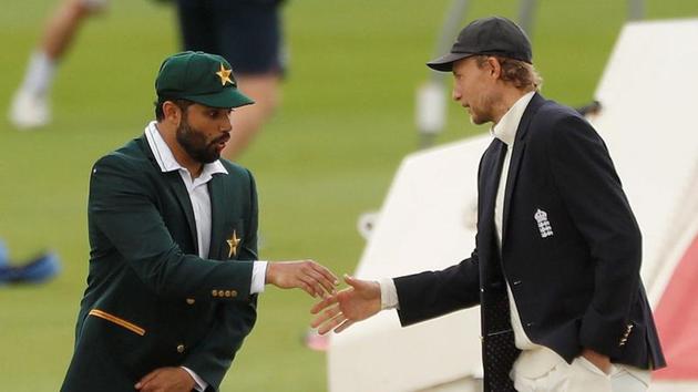File photo of Pakistan Test captain Azhar Ali shaking hands with England's Joe Root.(REUTERS)