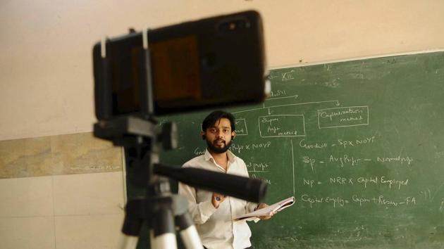 A teacher conducts an online class for his students at a Ghazipur government school earlier in October.(File photo)