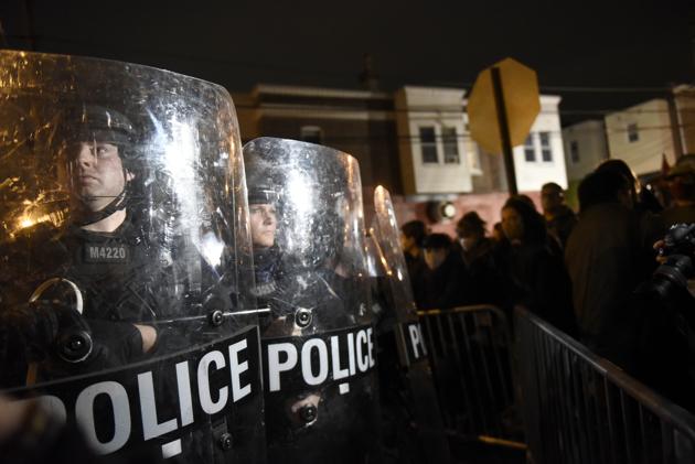 Philadelphia police officers form a line during a demonstration in Philadelphia, late Tuesday, Oct. 27, 2020. Hundreds of demonstrators marched in West Philadelphia over the death of Walter Wallace Jr., a Black man who was killed by police in Philadelphia on Monday. (AP Photo/Michael Perez)(AP)