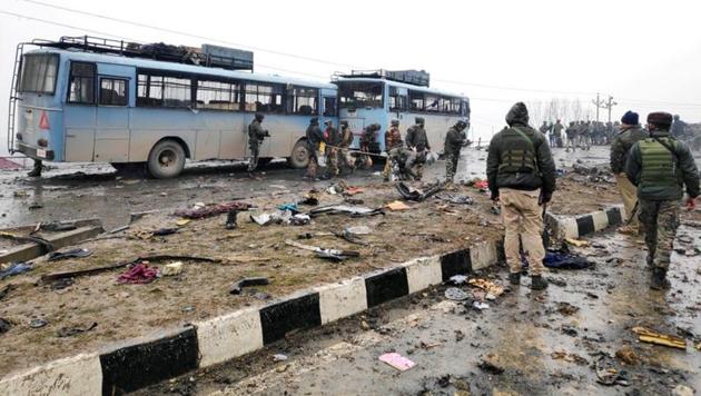 Indian soldiers examine the debris after an explosion in Lethpora in south Kashmir's Pulwama district on February 14, 2019.(Reuters file)