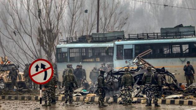 ecurity personnel carrying out the rescue and relief works at the site of suicide bomb attack at Lathepora Awantipora in Pulwama district of south Kashmir on February 14, 2019.(PTI Photo)