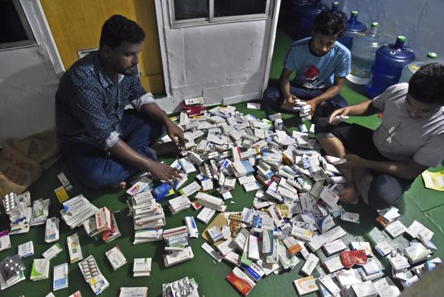 In this photo provided by Bidyanondo Foundation, health workers sort medicines in their boat hospital at Banishanta near Mongla seaport in southwestern region of Bangladesh, on Sept. 1, 2020. (AP)