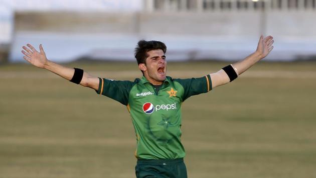 Pakistani pacer Shaheen Afridi celebrates after taking the wicket of Zimbabwe's batsman Chamu Chibhabha during their 1st one-day international cricket match against Zimbabwe at the Pindi Cricket Stadium, in Rawalpindi, Pakistan.(AP)