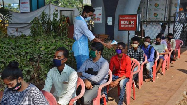 Health care workers conduct temperature and swab test at a Covid-19 testing centre at Manpada, Ghodbunder road in Thane on Thursday.(Praful Gangurde/HT Photo) Health care workers conduct temperature and swab test at a Covid-19 testing centre at Manpada, Ghodbunder road in Thane on Thursday.(Praful Gangurde/HT Photo)