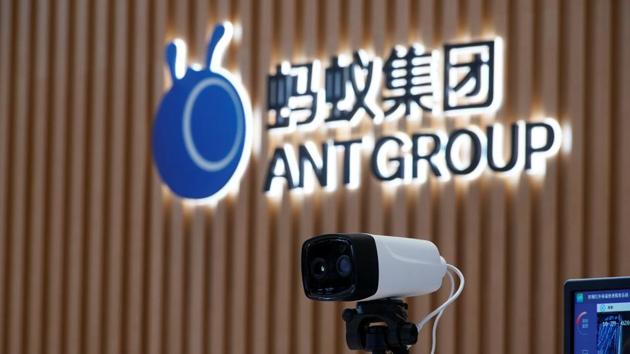 A thermal imaging camera is seen in front of a logo of Ant Group at the headquarters of Ant Group.(Reuters File Photo)