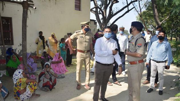Administration and police officials at the site of incident in the Bandoiya village, where Arjun Kori was allegedly set afire over money dispute in Amethi district on Friday.(PTI Photo) Administration and police officials at the site of incident in the Bandoiya village, where Arjun Kori was allegedly set afire over money dispute in Amethi district on Friday.(PTI Photo)