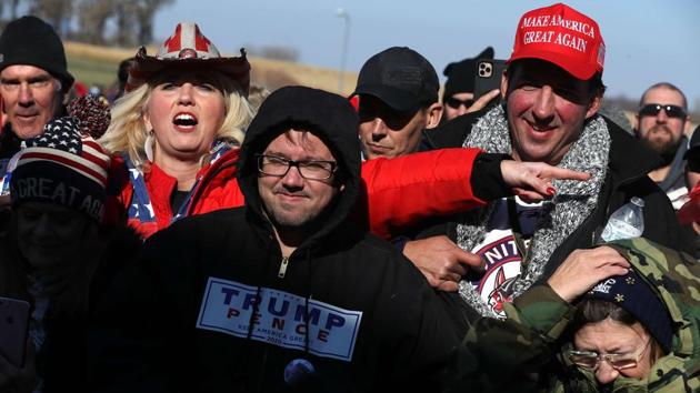 Supporters of US President Donald Trump wait in line to attend a campaign rally at Rochester International Airport on October 30. Meanwhile, President Donald Trump has been widely criticized for continuously downplaying the pandemic in US, even after catching the virus himself, last month. (Chip Somodevilla / AFP) Supporters of US President Donald Trump wait in line to attend a campaign rally at Rochester International Airport on October 30. Meanwhile, President Donald Trump has been widely criticized for continuously downplaying the pandemic in US, even after catching the virus himself, last month. (Chip Somodevilla / AFP)