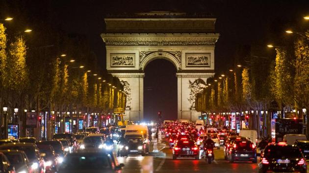 Traffic on the Champs Elysees, on the eve of the national lockdown, in Paris on October 29. Parisians fleeing for the countryside jammed the roads ahead of the lockdown coming into effect. Dystopian images of logjams — exacerbated by the upcoming long holiday weekend — were a grim sign of a return to the dark days of the spring, when virus cases first swelled in Europe. (Nathan Laine / Bloomberg)