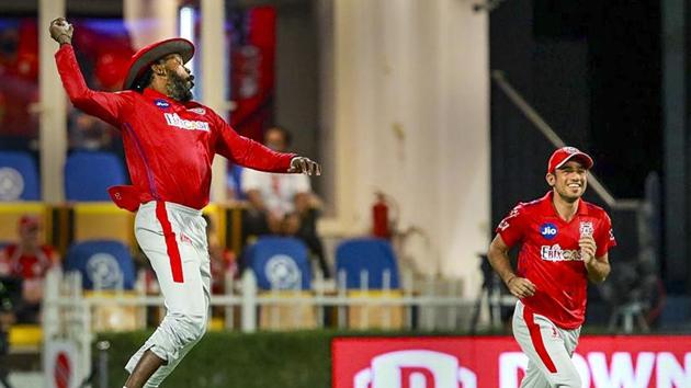 Chris Gayle of Kings XI Punjab celebrates after taking a catch for the dismissal of Nitesh Rana of Kolkata Knight Riders during their Indian Premier League (IPL) cricket match in Sharjah.(PTI)