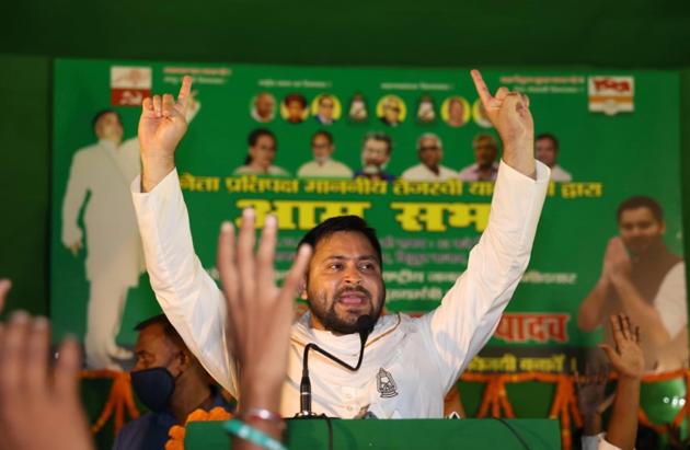RJD leader Tejashwi Yadav addresses a gathering during an election meeting in Raghopur on Oct 31, 2020.(PTI)