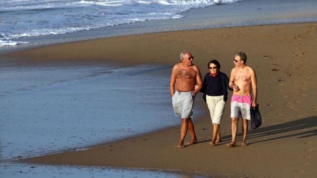 People walk on the beach on the first day of the nationwide lockdown, in Saint Jean de Luz on October 30. New daily cases of Covid-19 are currently averaging around 50,000 in France. On a per capita basis, France is seeing about two and a half times the number of new cases each day than the United States, AP reported. (Bob Edme / AP)