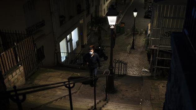 A man walks in Montmartre area of Paris, on October 30. The new lockdown adds to an already grim mood in France after three attacks in recent weeks blamed on Islamist extremists, the latest the killing of three people inside a church in Nice on October 29. (Lewis Joly / AP)