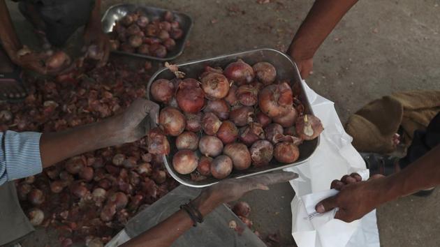 A total of 3.5 lakh ration card holders would be provided 3 kgs of onion each at Rs 32 per kg by holding a special drive across all fair price shops, the official said.(AP) A total of 3.5 lakh ration card holders would be provided 3 kgs of onion each at Rs 32 per kg by holding a special drive across all fair price shops, the official said.(AP)