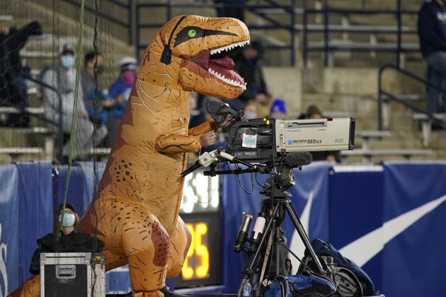 A cameraman dressed for Halloween operates a TV camera during an NCAA college football game between BYU and Western Kentucky Saturday, October 31, 2020, in Provo, Utah. (AP Photo/Rick Bowmer)