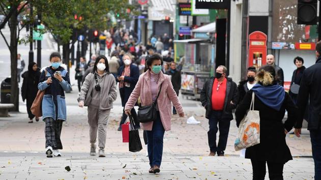 Pedestrians walk in central London on November 1 as England prepares to enter a second lockdown. As the experts ran through the latest figures and statistics showing a surge in the numbers being infected by the coronavirus, Prime Minister Johnson declared that “no responsible PM can ignore the message of those figures.” (Justin Tallis / AFP)