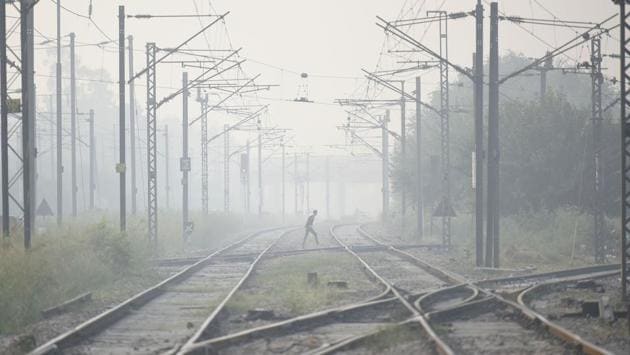 A man crosses a railway track at Nizamuddin on a hazy morning in New Delhi on October 30. According to the India Meteorological Department (IMD), this October was the coldest Delhi has experienced in 58 years, with the mean minimum temperature for the month settling at 17.2 degrees Celsius. (Biplov Bhuyan / HT Photo) A man crosses a railway track at Nizamuddin on a hazy morning in New Delhi on October 30. According to the India Meteorological Department (IMD), this October was the coldest Delhi has experienced in 58 years, with the mean minimum temperature for the month settling at 17.2 degrees Celsius. (Biplov Bhuyan / HT Photo)