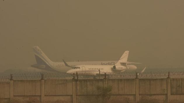 Aircraft parked on a taxiway at IGI Airport in New Delhi on October 29. The absence of cloud cover is a major reason for such low minimum temperatures. Clouds trap some of the outgoing infrared radiation and radiate it back downwards, warming the ground. Another reason is calm winds, which allow the formation of mist and fog,” head of IMD’s Regional Weather Forecasting Centre, Kuldeep Srivastava told HT. (Vipin Kumar / HT Photo) Aircraft parked on a taxiway at IGI Airport in New Delhi on October 29. The absence of cloud cover is a major reason for such low minimum temperatures. Clouds trap some of the outgoing infrared radiation and radiate it back downwards, warming the ground. Another reason is calm winds, which allow the formation of mist and fog,” head of IMD’s Regional Weather Forecasting Centre, Kuldeep Srivastava told HT. (Vipin Kumar / HT Photo)