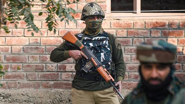 Security personnel stand guard during the encounter with militants, at Mouchwa on the outskirts of Srinagar, Wednesday, October 28, 2020.(PTI)