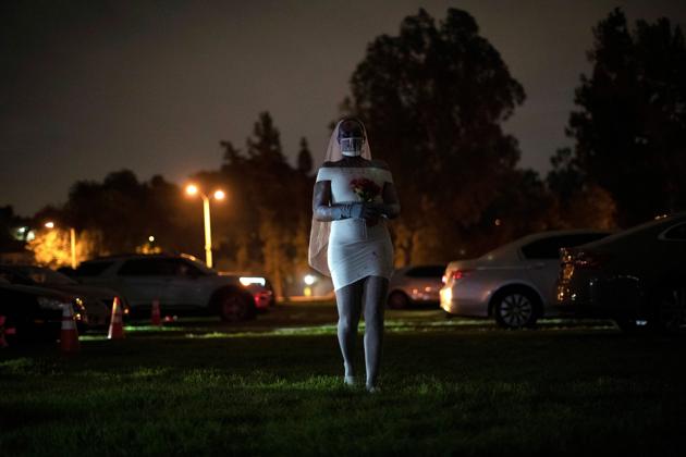 A performer dressed like a zombie is pictured at Joe Bob's Haunted Drive-In Halloween experience at Rose Bowl during the outbreak of the coronavirus disease, in Pasadena, California, U.S., October 31, 2020. (REUTERS/Mario Anzuoni)