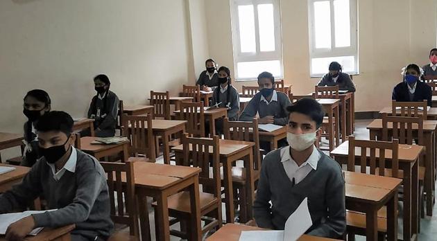 Students wearing masks and attending classes in a school in Mussoorie.(HT Photo)