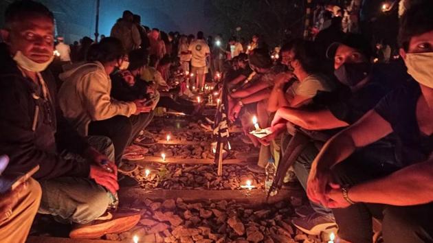Hundreds of protesters gathered at Chandor in south Goa and camped along the railway track with candles against the state government’s move to push through railway expansion through a stretch located between Margao and Sanvordem.(HT photo)