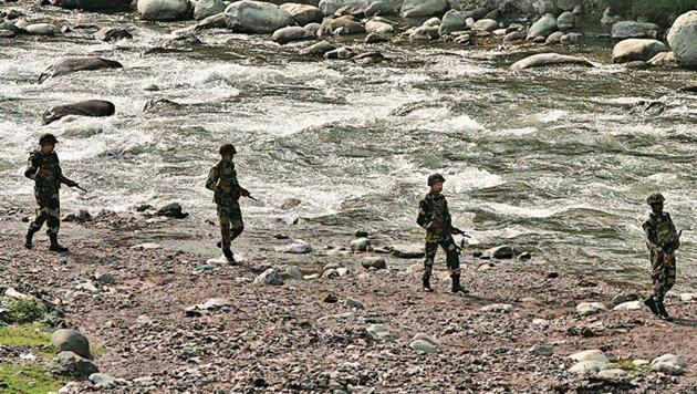 BSF men patrol next to a stream near the LoC in the Sabjiyan sector of Poonch district. (Reuters file photo) BSF men patrol next to a stream near the LoC in the Sabjiyan sector of Poonch district. (Reuters file photo)