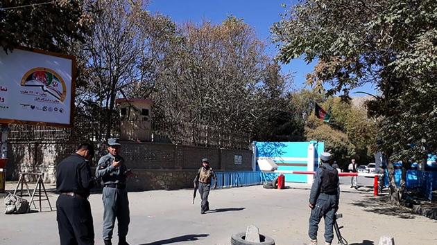 Policemen stand guard at an entrance gate of the Kabul University in Kabul on November 2, 2020.(AFP)