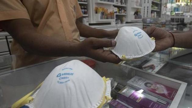 A customer buys N95 mask from a medical shop at Karve road in Pune. (Pratham Gokhale/HT Photo) A customer buys N95 mask from a medical shop at Karve road in Pune. (Pratham Gokhale/HT Photo)