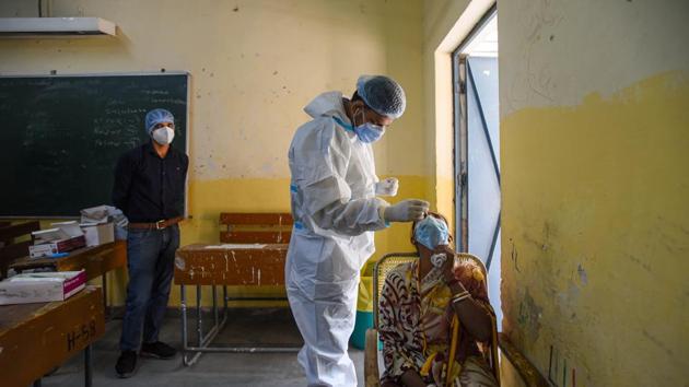 With 45,230 new infections in the last 24 hours, India’s total Covid-19 tally reached 82,29,313 on Monday. (Amal KS/HT Photo) With 45,230 new infections in the last 24 hours, India’s total Covid-19 tally reached 82,29,313 on Monday. (Amal KS/HT Photo)