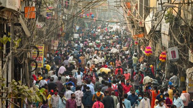 People, flouting social distancing norms, visit a crowded Sadar Bazar market during the festive season in New Delhi on Monday.(PTI Photo)