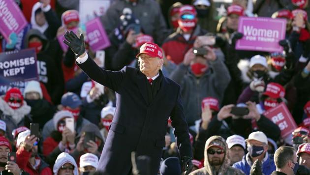 President Donald Trump waves to supporters at the end of a campaign rally at Dubuque Regional Airport, Sunday, Nov. 1, 2020, in Dubuque, Iowa. (AP photo) President Donald Trump waves to supporters at the end of a campaign rally at Dubuque Regional Airport, Sunday, Nov. 1, 2020, in Dubuque, Iowa. (AP photo)