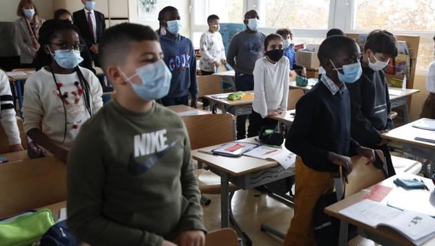 Schoolchildren observe a minute of silence for slain history teacher Samuel Paty, Monday Nov.2, 2020 in Strasbourg, eastern France (AP Photo/Jean-Francois Badias) (AP) Schoolchildren observe a minute of silence for slain history teacher Samuel Paty, Monday Nov.2, 2020 in Strasbourg, eastern France (AP Photo/Jean-Francois Badias) (AP)