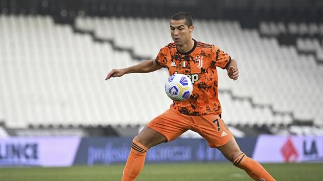 Juventus' Cristiano Ronaldo goes for the ball during the Serie A soccer match between Spezia and Juventus, at the Dino Manuzzi Stadium in Cesena, Italy, Sunday, Nov. 1, 2020. (Massimo Paolone/LaPresse via AP)(AP)