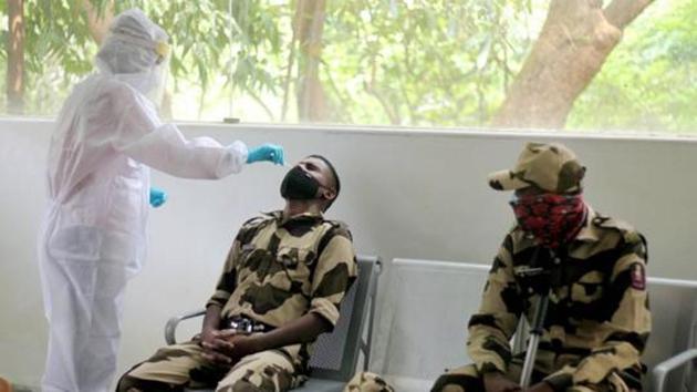 A health worker takes nasal swab samples from Maharashtra Security Force personnel for Covid-19 tests, at Film City in Mumbai, on October 23. (File photo) A health worker takes nasal swab samples from Maharashtra Security Force personnel for Covid-19 tests, at Film City in Mumbai, on October 23. (File photo)