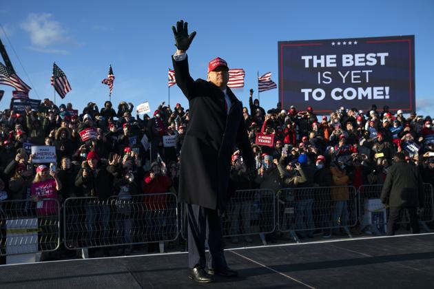 President Donald Trump walks off stage after speaking during a campaign rally. (AP) President Donald Trump walks off stage after speaking during a campaign rally. (AP)