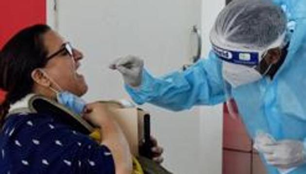 A medic in PPE collects swab samples from a person. Pune hospitals have been running post-Covid-19 OPDs for over a month and are reporting various health issues among patients. (ANI (FOR REPRESENTATIONAL PURPOSE ONLY)) A medic in PPE collects swab samples from a person. Pune hospitals have been running post-Covid-19 OPDs for over a month and are reporting various health issues among patients. (ANI (FOR REPRESENTATIONAL PURPOSE ONLY))