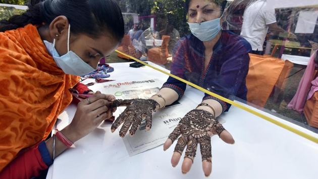 A woman applies henna on the eve of Karva Chauth festival in New Delhi on November 3. Even as active cases lower country-wide, some states such as Manipur, Delhi, Kerala and West Bengal continue to see a surge in caseloads. Delhi recorded 6,725 new single-day cases on November 3, the highest for the capital since the outbreak. (Sanjeev Verma / HT Photo) A woman applies henna on the eve of Karva Chauth festival in New Delhi on November 3. Even as active cases lower country-wide, some states such as Manipur, Delhi, Kerala and West Bengal continue to see a surge in caseloads. Delhi recorded 6,725 new single-day cases on November 3, the highest for the capital since the outbreak. (Sanjeev Verma / HT Photo)
