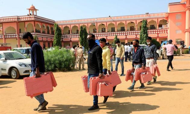 Election officials leave for their respective polling stations after collecting Electronic Voting Machines (EVMs) in Jaipur. (PTI) Election officials leave for their respective polling stations after collecting Electronic Voting Machines (EVMs) in Jaipur. (PTI)