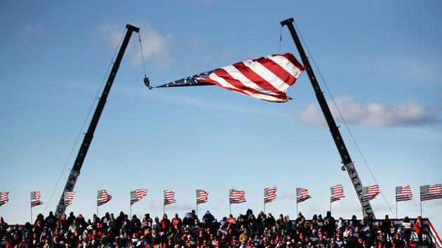 People watch as President Donald Trump speaks at a rally on November 02, 2020 in Avoca, Pennsylvania. (AFP photo) People watch as President Donald Trump speaks at a rally on November 02, 2020 in Avoca, Pennsylvania. (AFP photo)