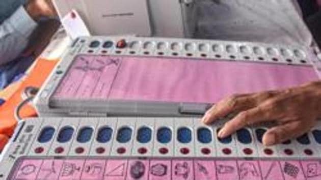 Electronic Voting Machine (EVM) sealing officers check EVMs and Voter-Verified Paper Audit Trail (VVPATs) ahead of the second phase of Bihar assembly polls, in Patna.(PTI)