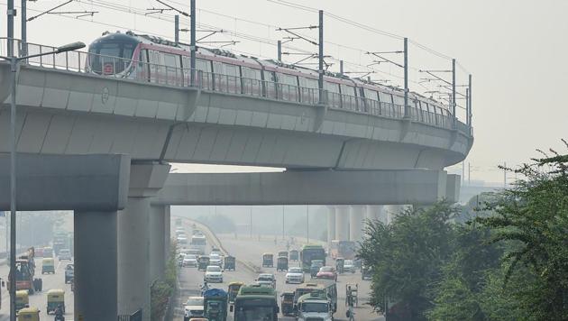 A Metro train runs on a track, amid hazy weather conditions, in New Delhi on November 2. (PTI) A Metro train runs on a track, amid hazy weather conditions, in New Delhi on November 2. (PTI)