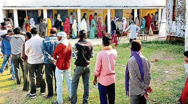 People wait to cast their votes in Madhya Pradesh’s Raisen district on Tuesday. (PTI photo) People wait to cast their votes in Madhya Pradesh’s Raisen district on Tuesday. (PTI photo)