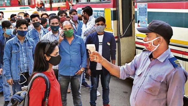 A passenger is screened at Anand Vihar ISBT.(Raj K Raj/HT photo)