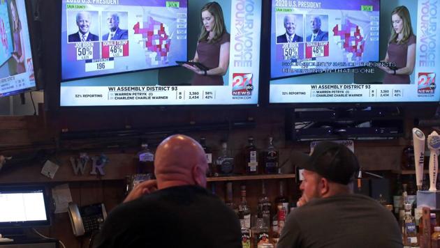 People watch US election results on November 3 in Janesville, Wisconsin.(AFP) People watch US election results on November 3 in Janesville, Wisconsin.(AFP)