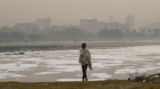 A man walks along the banks of the Yamuna River on November 3. Kuldeep Srivastava, the head of IMD’s regional weather forecasting centre told HT that temperatures dropping to such levels were highly unusual for Delhi and NCR towns at this time of the year. (Money Sharma / AFP) A man walks along the banks of the Yamuna River on November 3. Kuldeep Srivastava, the head of IMD’s regional weather forecasting centre told HT that temperatures dropping to such levels were highly unusual for Delhi and NCR towns at this time of the year. (Money Sharma / AFP)