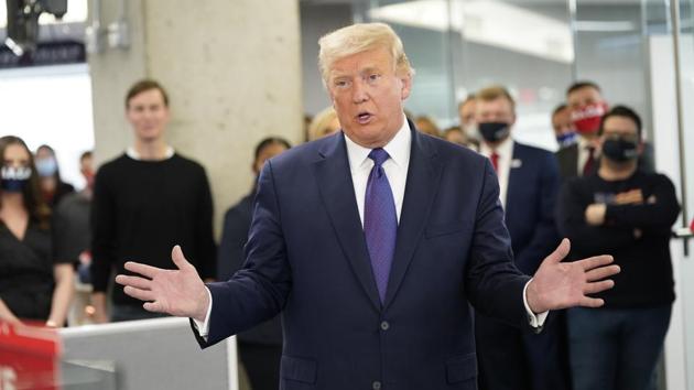 US President Donald Trump visits campaign workers at the RNC Annex in Arlington, Virginia on November 3. Trump called in to “Fox & Friends,” where he predicted he will win by a larger electoral margin than he did in 2016 when he tallied 306 electoral college votes compared to Democrat Hillary Clinton’s 232. (Chris Kleponis / CNP / Bloomberg ) US President Donald Trump visits campaign workers at the RNC Annex in Arlington, Virginia on November 3. Trump called in to “Fox & Friends,” where he predicted he will win by a larger electoral margin than he did in 2016 when he tallied 306 electoral college votes compared to Democrat Hillary Clinton’s 232. (Chris Kleponis / CNP / Bloomberg )