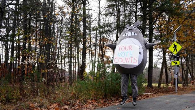 A man dressed as a character from “My Neighbor Totoro” stands outside a polling station in Brunswick, Maine on November 3. On the final full day on the campaign trail on November 2, Trump and Biden broke sharply over the mechanics of the vote itself while visiting the most fiercely contested battleground, Pennsylvania. (Elizabeth Frantz / REUTERS) A man dressed as a character from “My Neighbor Totoro” stands outside a polling station in Brunswick, Maine on November 3. On the final full day on the campaign trail on November 2, Trump and Biden broke sharply over the mechanics of the vote itself while visiting the most fiercely contested battleground, Pennsylvania. (Elizabeth Frantz / REUTERS)